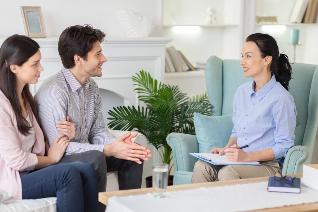 Couple sitting together during a couples therapy session, representing reconnection and guided support in Orlando